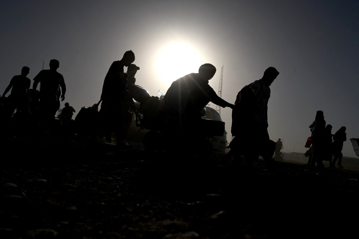 AFP__20250628__646W3R4__v1__MidRes__AfghanistanIranMigrants.jpg