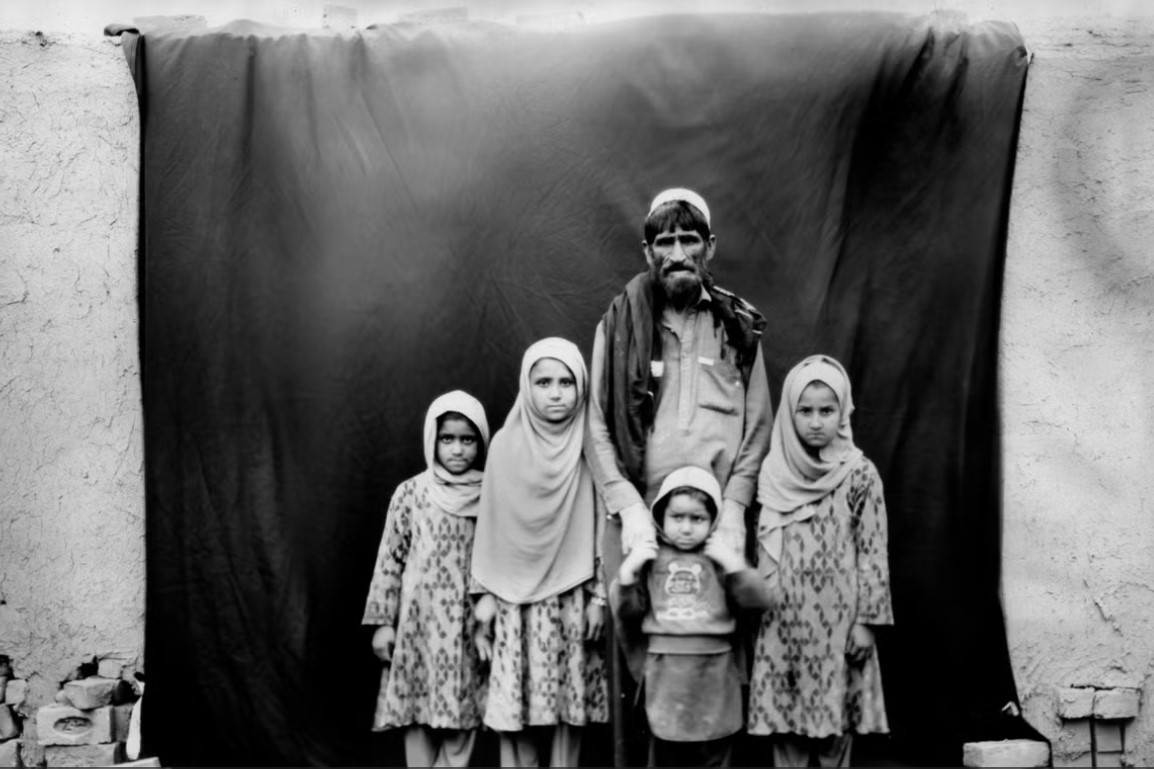 AP box camera afghan family .jpg