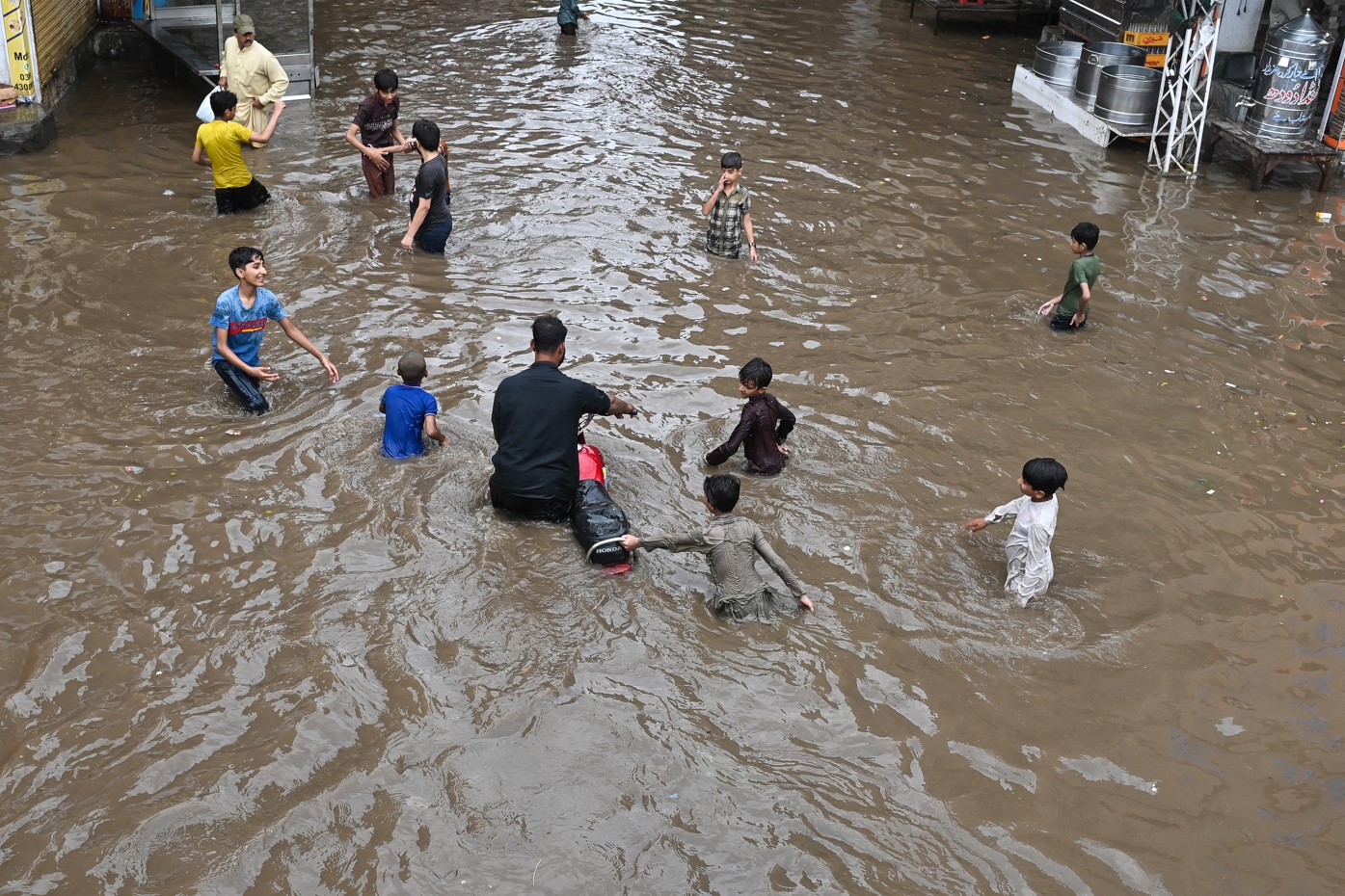 CHILDREN PLAYING FLOODS.jpg