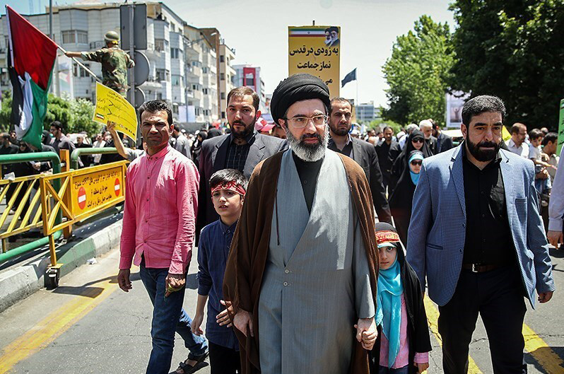 Mojtaba_Khamenei_and_his_children_in_Quds_Day_1397.jpg