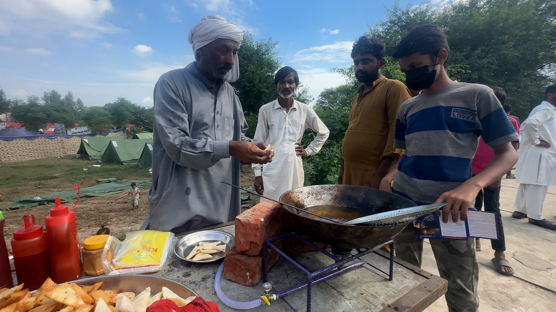 Lahore Flood Camp Samosa Seller 